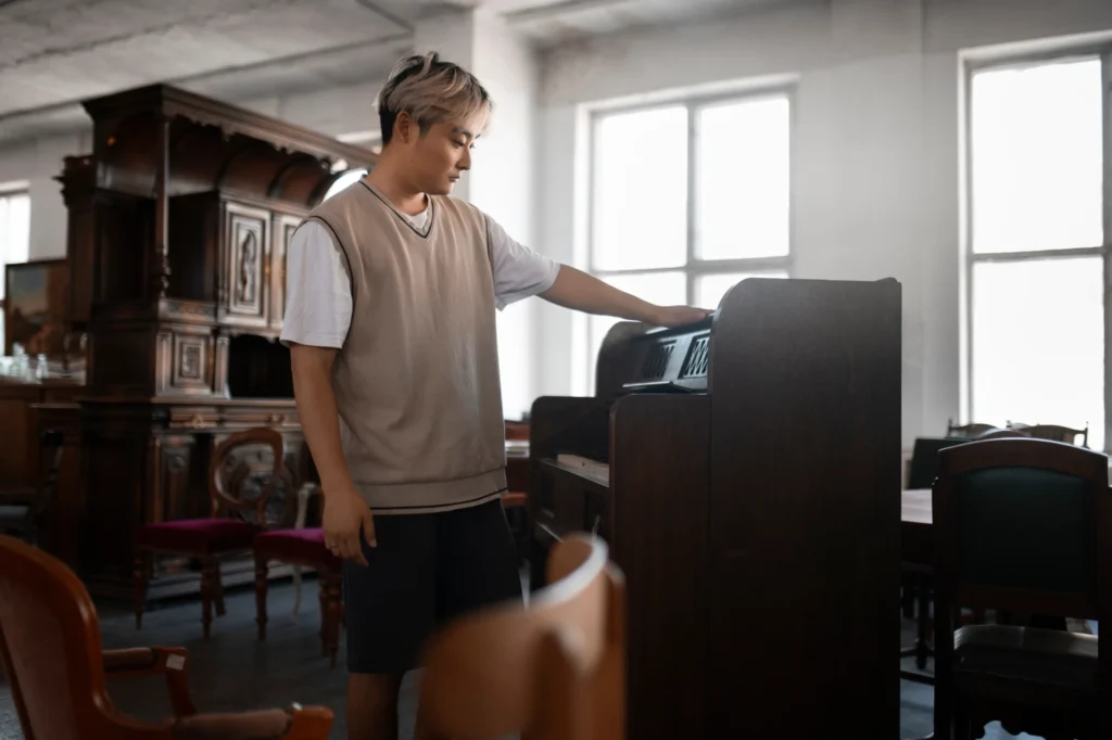 person looking at a piano