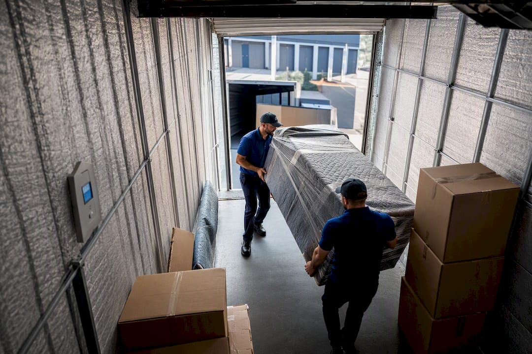 Movers loading climate controlled storage unit